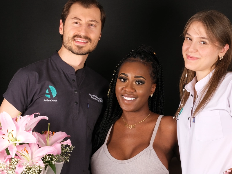 Dt. Dilek and patient whose treatment was completed dt. dilek and her patient gives pose side to side after dental crown treatment in Antalya