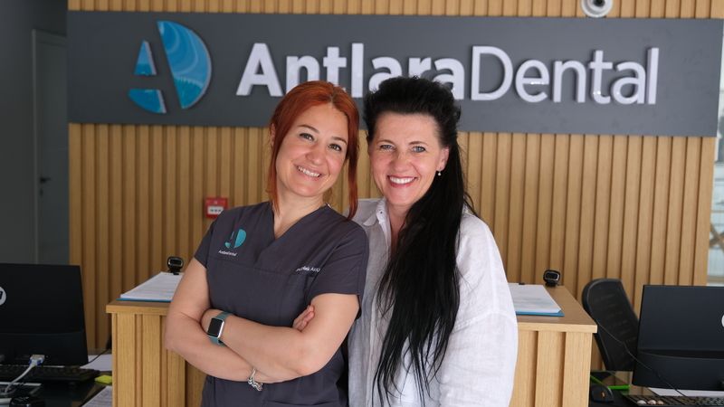Dt. Dilek and a women who had Invisalign gives pose for cameras